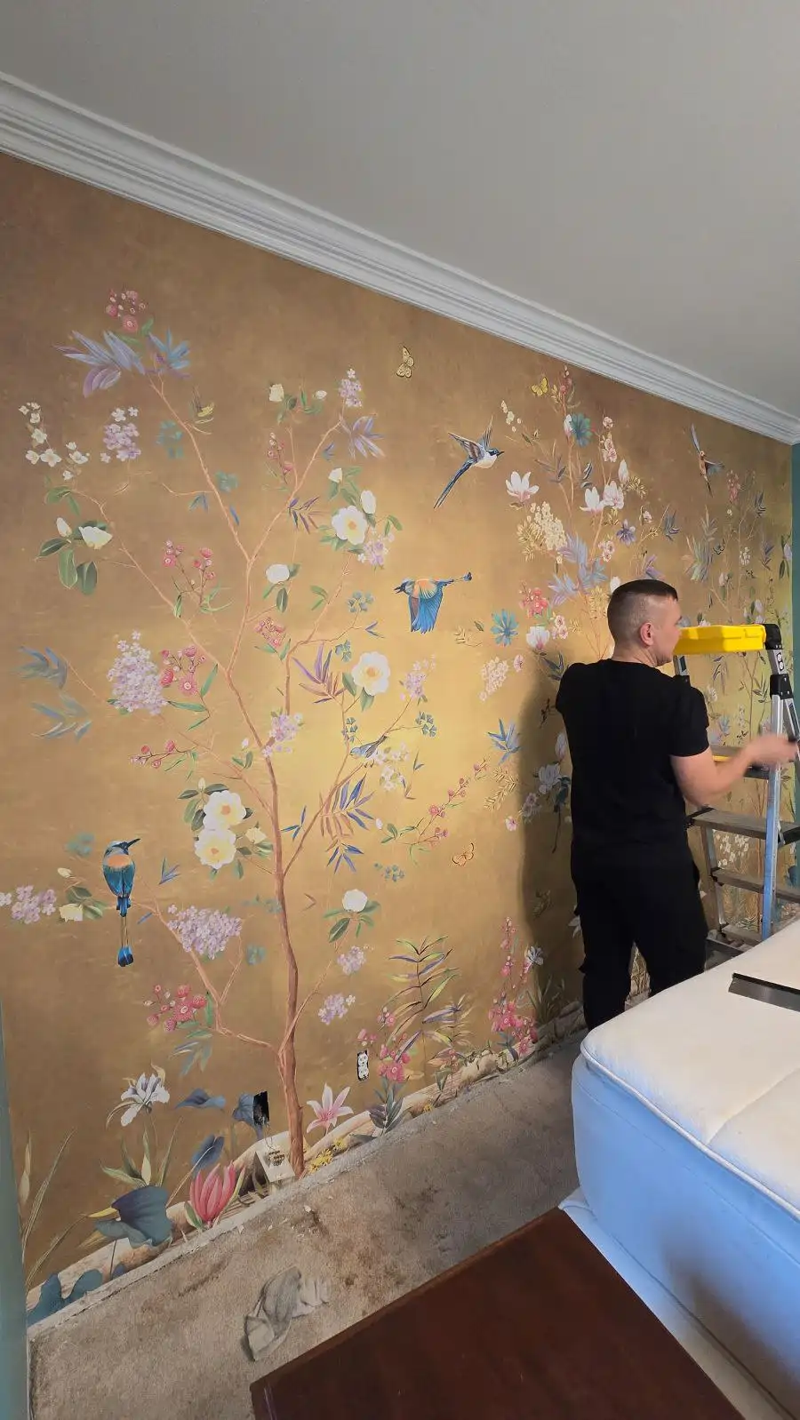 Chicago Wallpaper Perfection - Wallpaper installation master working on decorative mural