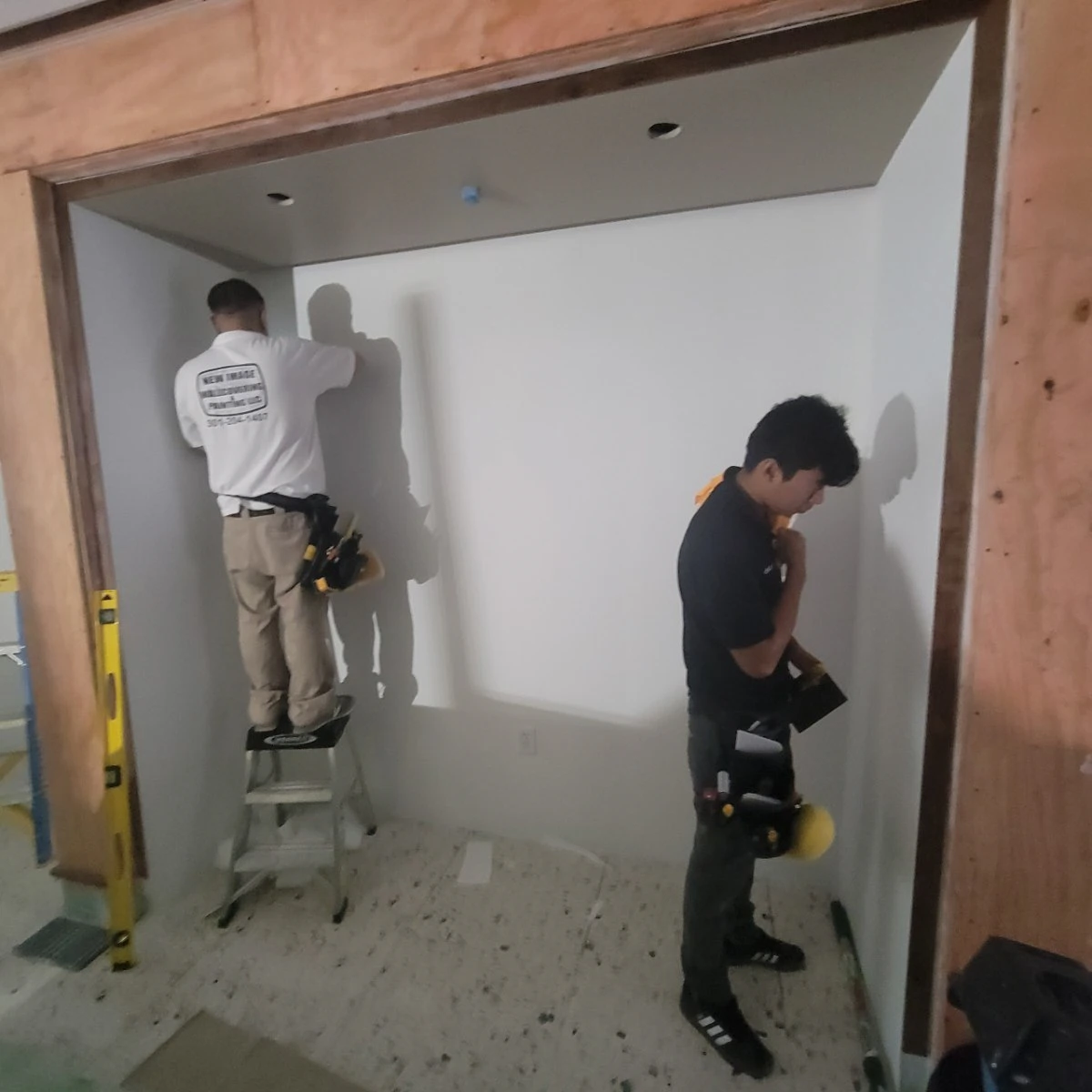 Chicago Wallpaper Perfection - Expert wallpaper craftsmen preparing walls for commercial installation