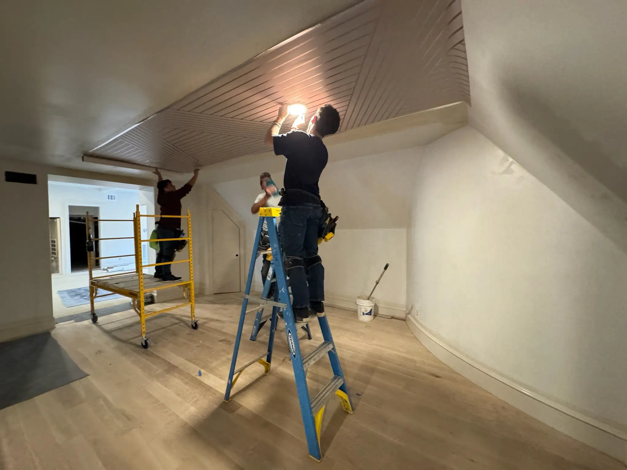 Chicago Wallpaper Perfection - Professional wallpaper installation team working on ceiling project